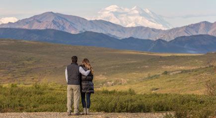 Couple looking out at the mountains in Alaska