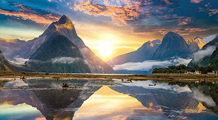 Sunset behind the mountains in Milford Sound