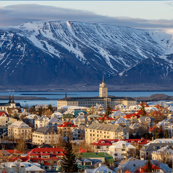 View of Reykjavik with snowy mountains behind it