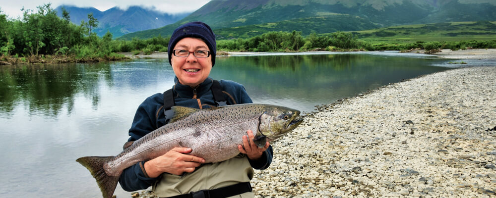 Woman with king salmon