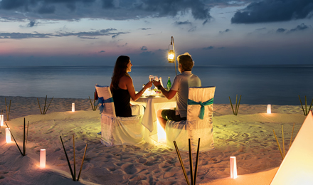 A couple dining on the beach