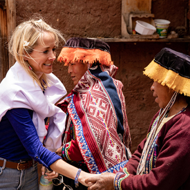 A woman greeting locals